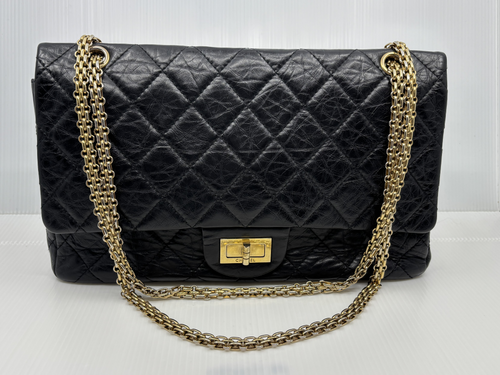 Chanel Reissue 2.55 Double Flap in black aged calfskin with gold-tone chain, front view