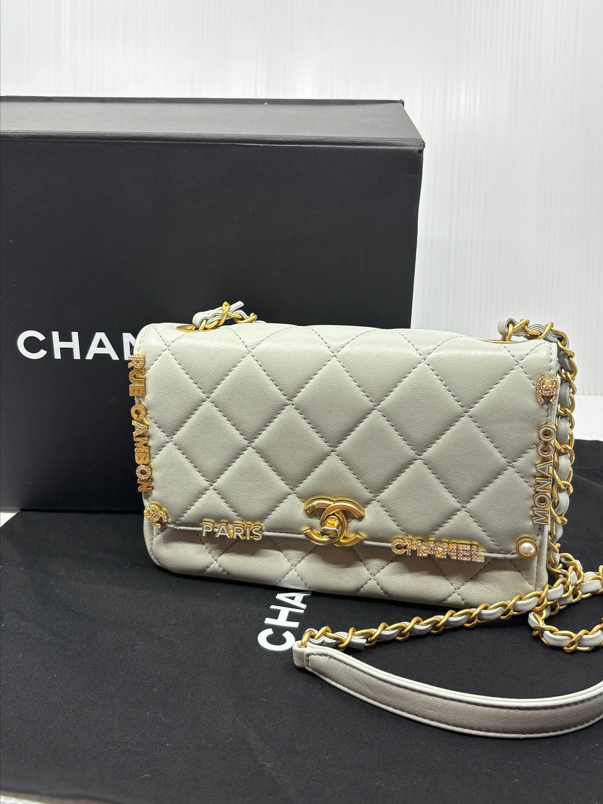 Chanel Quilted Flap Bag – Ivory with Paris Charms, Box and Dust Bag (NM924-23)